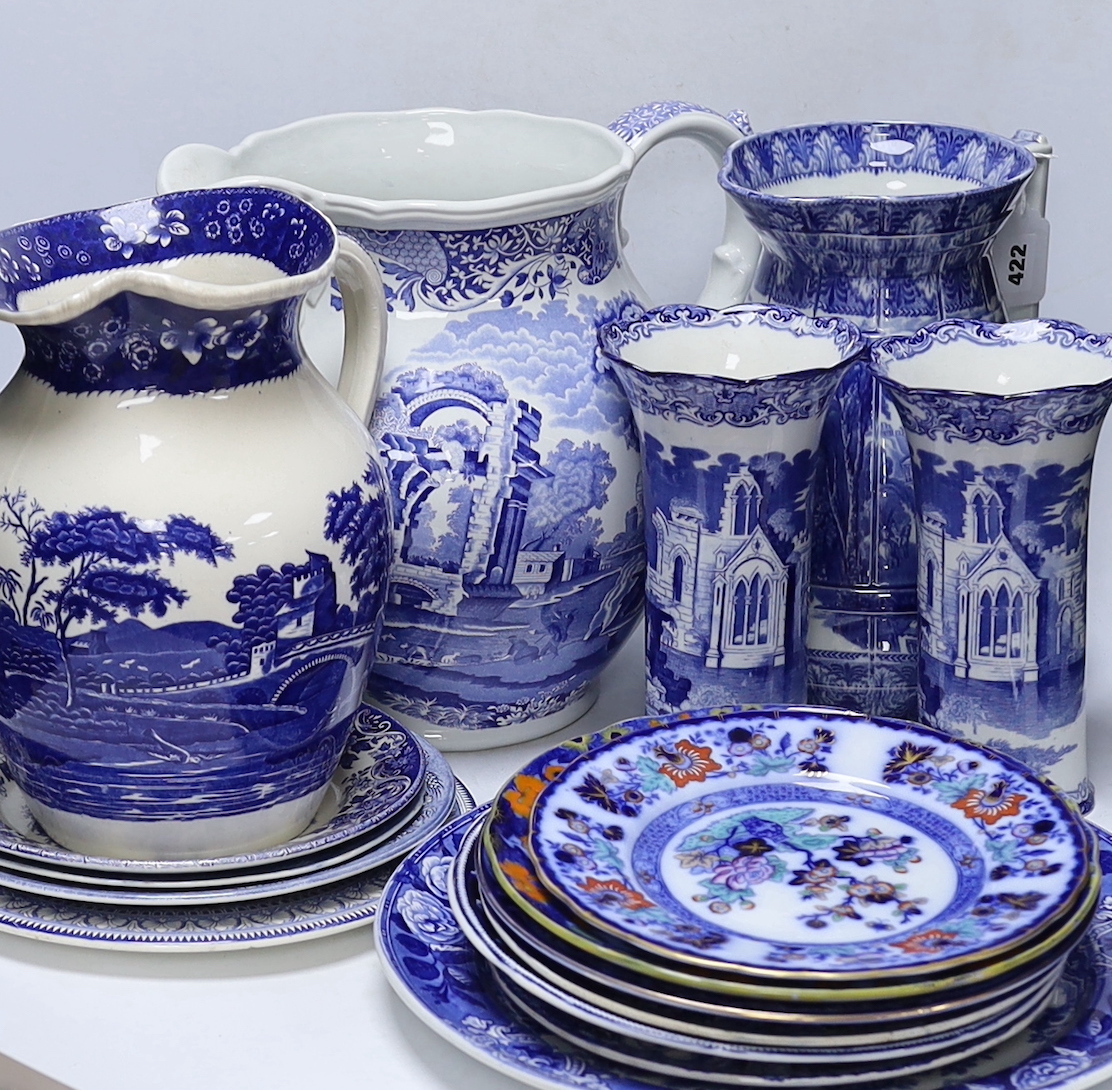 A quantity of blue and white plates, jugs, etc. including a large Spode Italian pattern jug, a George Jones Spanish costumes dish, a Cauldon ewer etc tallest 29cm (16)